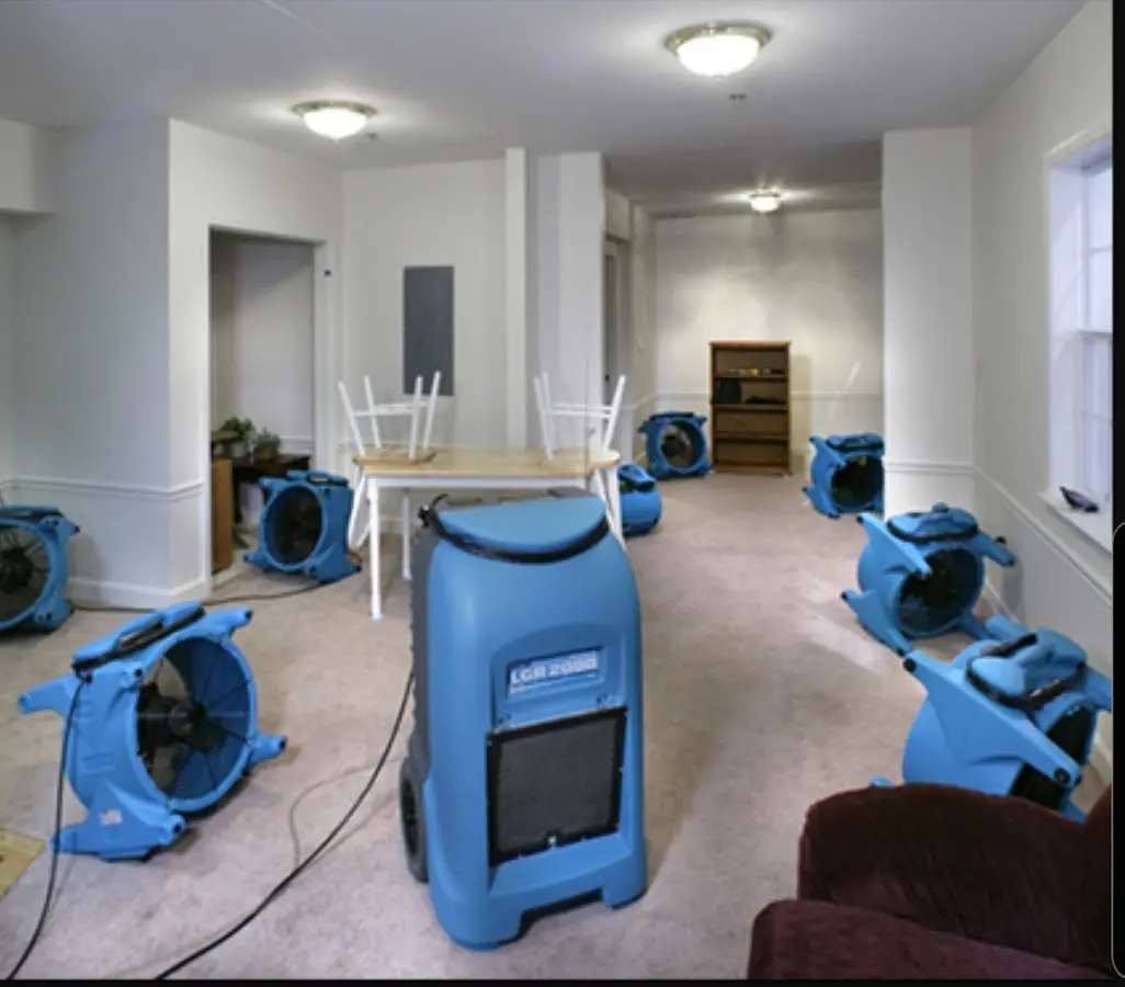 Air movers and dehumidifier setup for Water Damage Restoration in Hastings